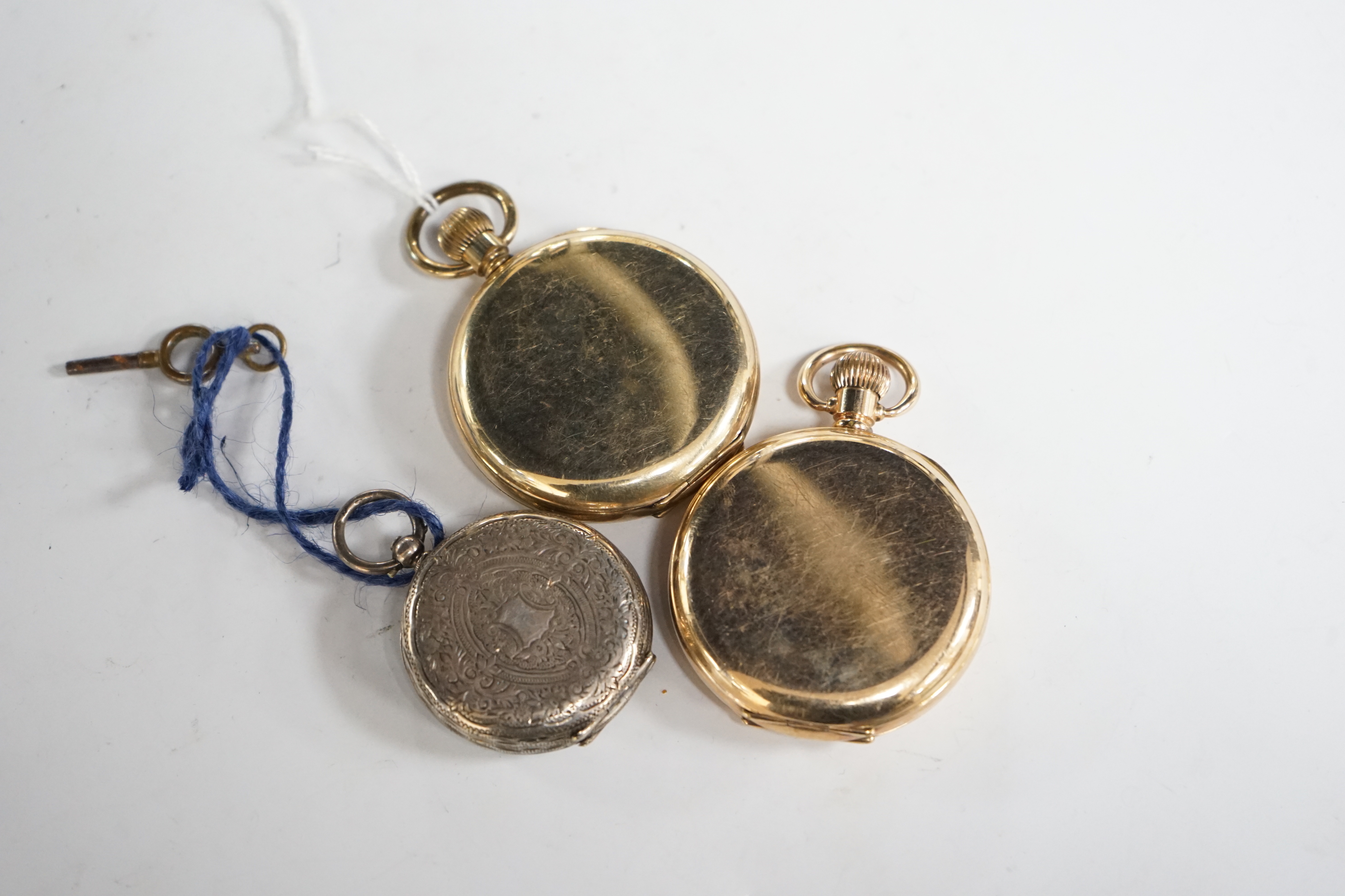 A continental engraved 935 white metal open face fob watch, together with an Elgin gold plated open face pocket watch and a gold plated half hunter pocket watch.